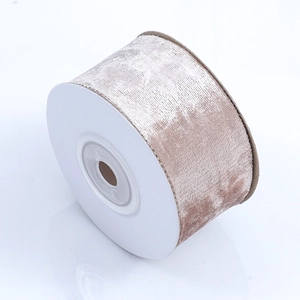 Close-up of champagne velvet ribbon roll showing soft texture for DIY crafts and decor