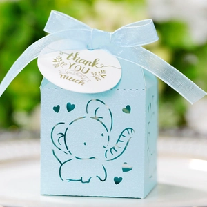 Detail of light blue baby shower favor box with hollow elephant cutout and satin ribbon