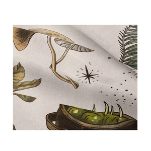 Close-up of retro hand-drawn mushroom and leaf patterns on a woven textile tapestry