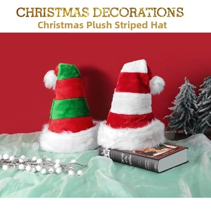 Detail of red and green striped plush Christmas hats with soft white pom-poms