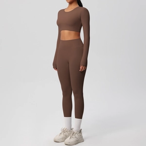 Side view of matte brown yoga set with long sleeve crop top and high waist leggings