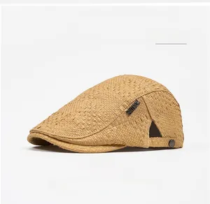 Detailed close-up of khaki straw flat cap with breathable texture and metal side buckle