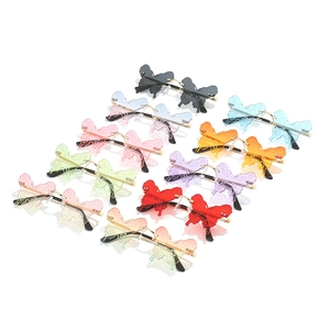 Fashion butterfly rimless sunglasses in various vibrant colors for parties and festivals