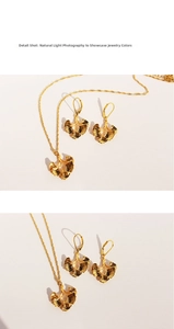 Detail shot of golden ginkgo leaf jewelry set featuring realistic vein texture and fine chain