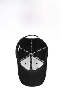 Detail of baseball cap interior showing NYCA branded stitching and six-panel structure