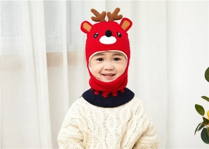 Detail of red knitted reindeer hooded scarf with cute cartoon antlers for kids winter wear