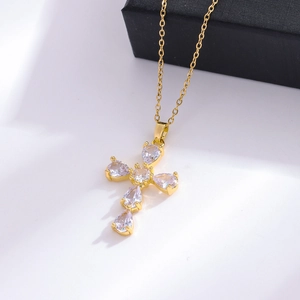 Luxurious gold stainless steel cross necklace with shimmering cubic zirconia gemstones