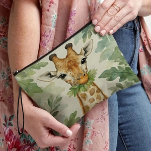 Portable giraffe print makeup bag featuring a zipper closure and black wrist strap