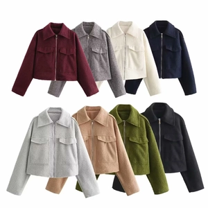 Detail of short wool blend jackets in multiple colors with zippers and large front pockets