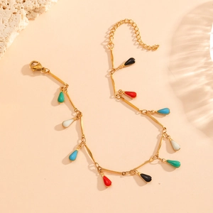 18K gold plated chain bracelet with colorful teardrop enamel pendants on beige surface