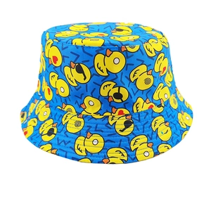 Close-up detail of blue cotton bucket hat featuring all-over yellow cartoon duck pattern