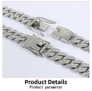 Macro detail of silver Cuban link chain with micro pave rhinestones and side-press buckle