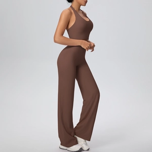 Detail view of brown halter neck sports bra and high-waisted flared yoga pants set