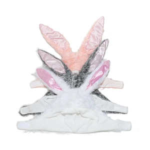 Detail of plush bunny ear hats for pets with soft fur texture and velcro strap