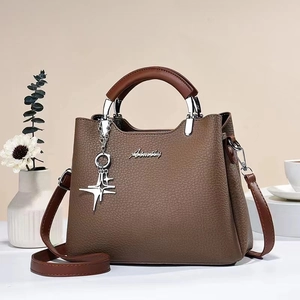 Brown litchi grain leather handbag with star charm and detachable shoulder strap