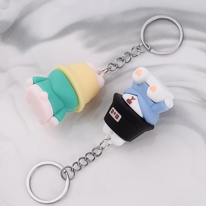 Cute PVC fisherman bear keychain in yellow and black outfits with silver metal ring