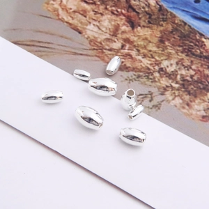 Macro shot of oval S925 sterling silver beads for DIY jewelry making and bracelet design