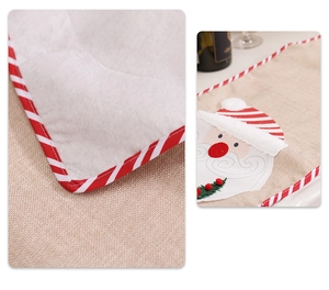 Close-up of Santa Claus burlap table runner showing embroidery and red striped edging
