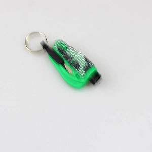 Close-up of a green mini 2-in-1 window breaker keychain and seatbelt cutter tool
