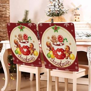 Detail of red Christmas chair covers with gingerbread man mugs and cursive text