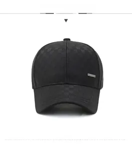 Close-up of black checkered texture and metal logo detail on men's baseball cap
