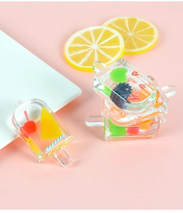 Detailed view of resin popsicle charm with miniature fruit slices and clear texture