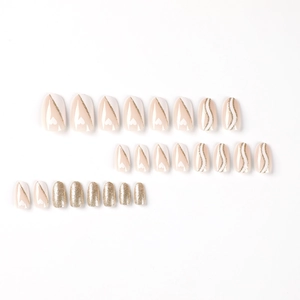 Short oval press-on nails set with nude pink, white heart designs and gold glitter finish