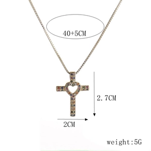 Gold-plated cross heart necklace with colorful zircons on a white background
