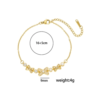 Gold luxury zircon bracelet with X-shaped pendants and measurements on white background