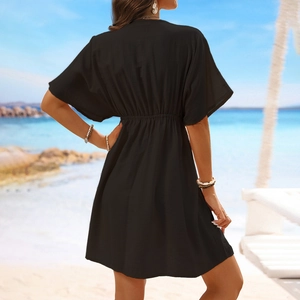 Close-up of black ice silk beach cover-up featuring lace stitching and waist detail