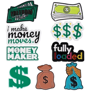 Set of 10 financial freedom theme enamel pins featuring money bags and dollar signs