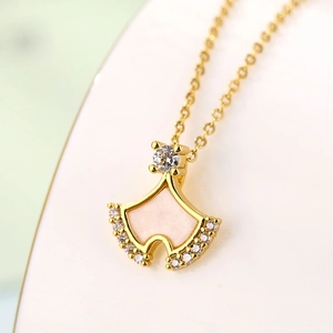 Elegant gold ginkgo leaf necklace with shell inlay and cubic zirconia crystals