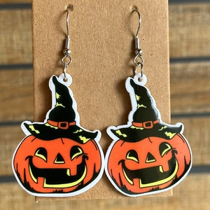 Halloween acrylic earrings with pumpkin face and wizard hat design on craft card