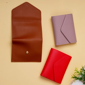 Three envelope style PU leather wallets in brown, lilac and red with gold magnetic clasps