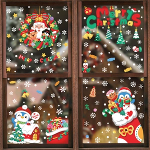 Weihnachts-Fensteraufkleber Set mit Weihnachtsmann, Pinguin und Schneeflocken auf Fensterglas