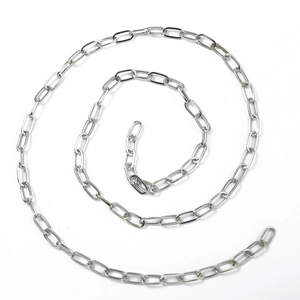Detailed view of silver stainless steel flat snake chain coiled in a spiral design