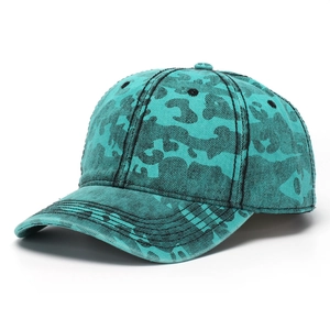 Close-up of washed cotton camouflage baseball cap with six-panel stitching and curved brim