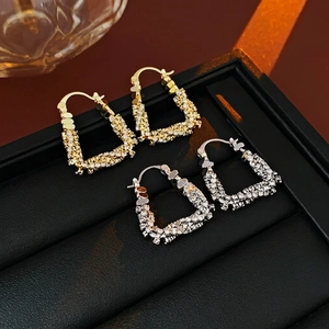 U-shaped huggie hoop earrings with micro-paved zircons in gold and silver plating