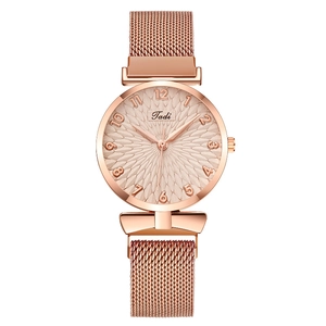 Detail showing the rose gold sunburst dial with Arabic numerals and metallic mesh band