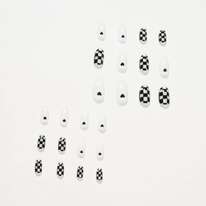 Glossy oval press-on nails featuring black and white checkerboard and heart designs
