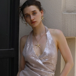 18K gold plated stainless steel starfish necklace and earrings set worn by a model