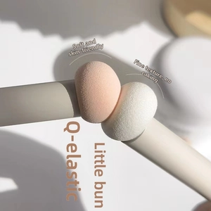 Close-up of soft mushroom sponge concealer brush showing high elastic bounce texture
