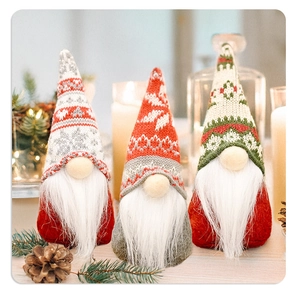 Detailed knit texture and plush beard of standing Christmas gnomes set on a festive table