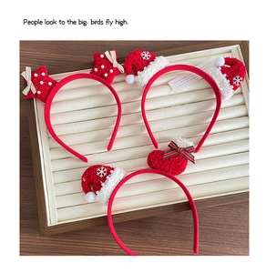 Detailed set of Christmas knit headbands with stars, Santa hats and socks decorations