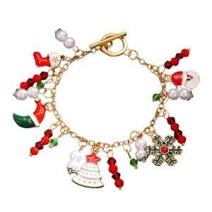 Christmas charm bracelet with Santa, snowflake and tree pendants on a gold chain
