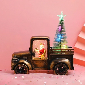 Vintage bronze Santa tractor water lantern with glowing Christmas tree on pink stars