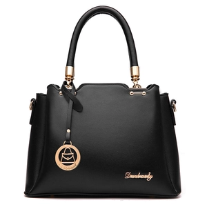 Classic black PU leather tote bag with top handles and gold hardware on white background
