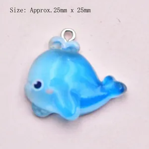 Detail view of blue resin dolphin pendant with dimensions of 25mm x 25mm for DIY