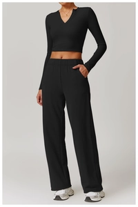 Detail shot of the V-neck opening and high-density knit fabric on the slim yoga top