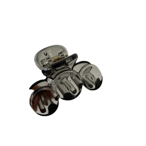Minimalist dark gray translucent hair claw clip with durable metal spring on white background